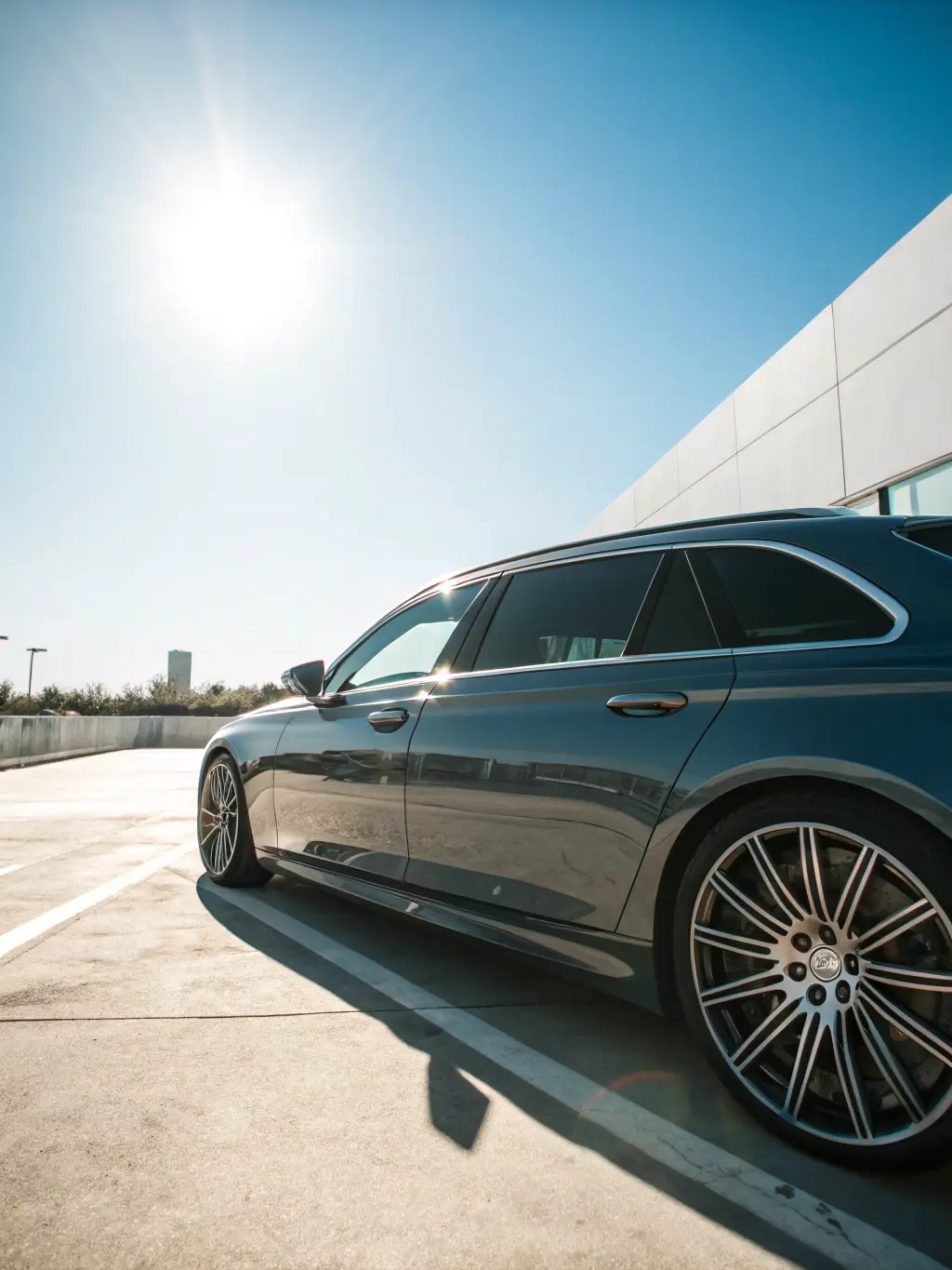 Image of a car parked in direct sunlight, with PPF protecting the paint from UV damage and fading.