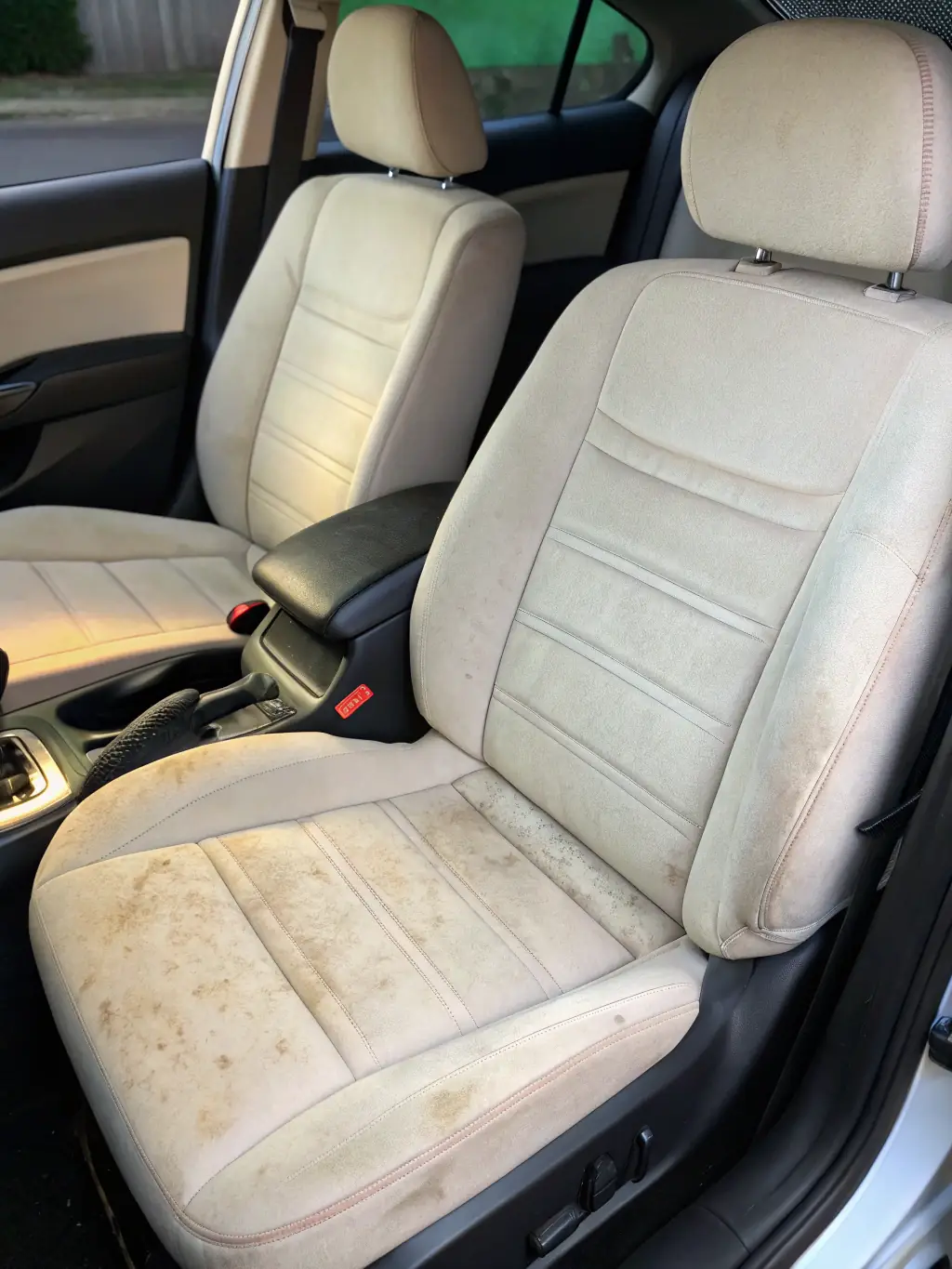 A before-and-after comparison of a car seat, showing the reduced wear and fading after applying the ceramic coating. The seats are visibly different, demonstrating the coating's long-term benefits.