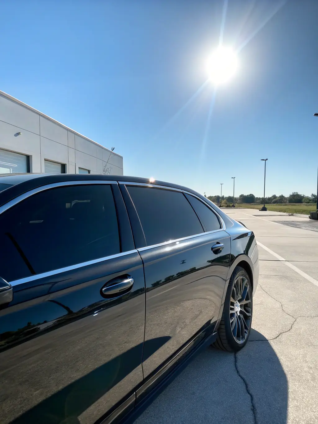 A clear, vibrant photo of tinted windows on a powersports vehicle (like a side-by-side), demonstrating the sleek look and the reduction in glare and heat inside the cabin.